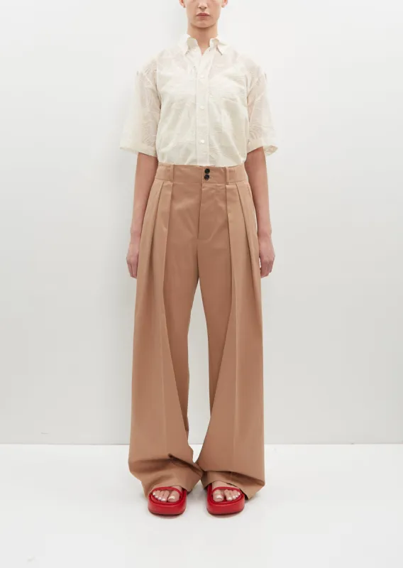 Stretch Cotton Pleated Trousers sold by La Garconne