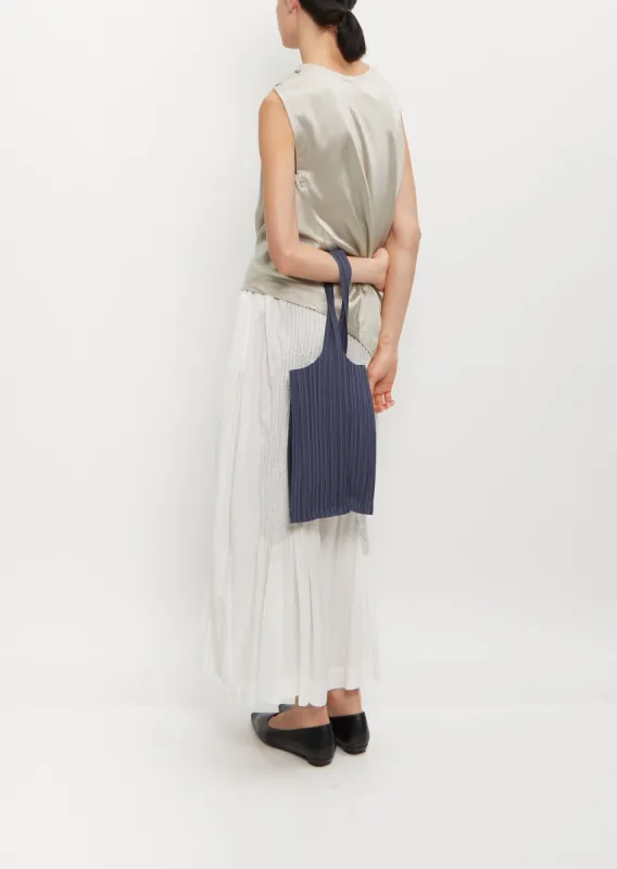 Daily Pleats Bag sold by La Garconne