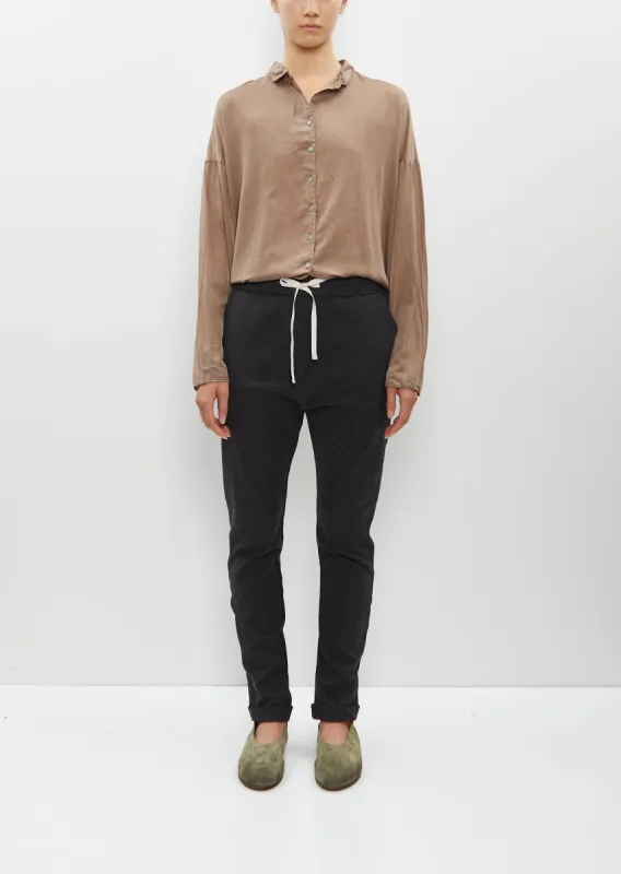 Stretch Wool Slim Trousers sold by La Garconne