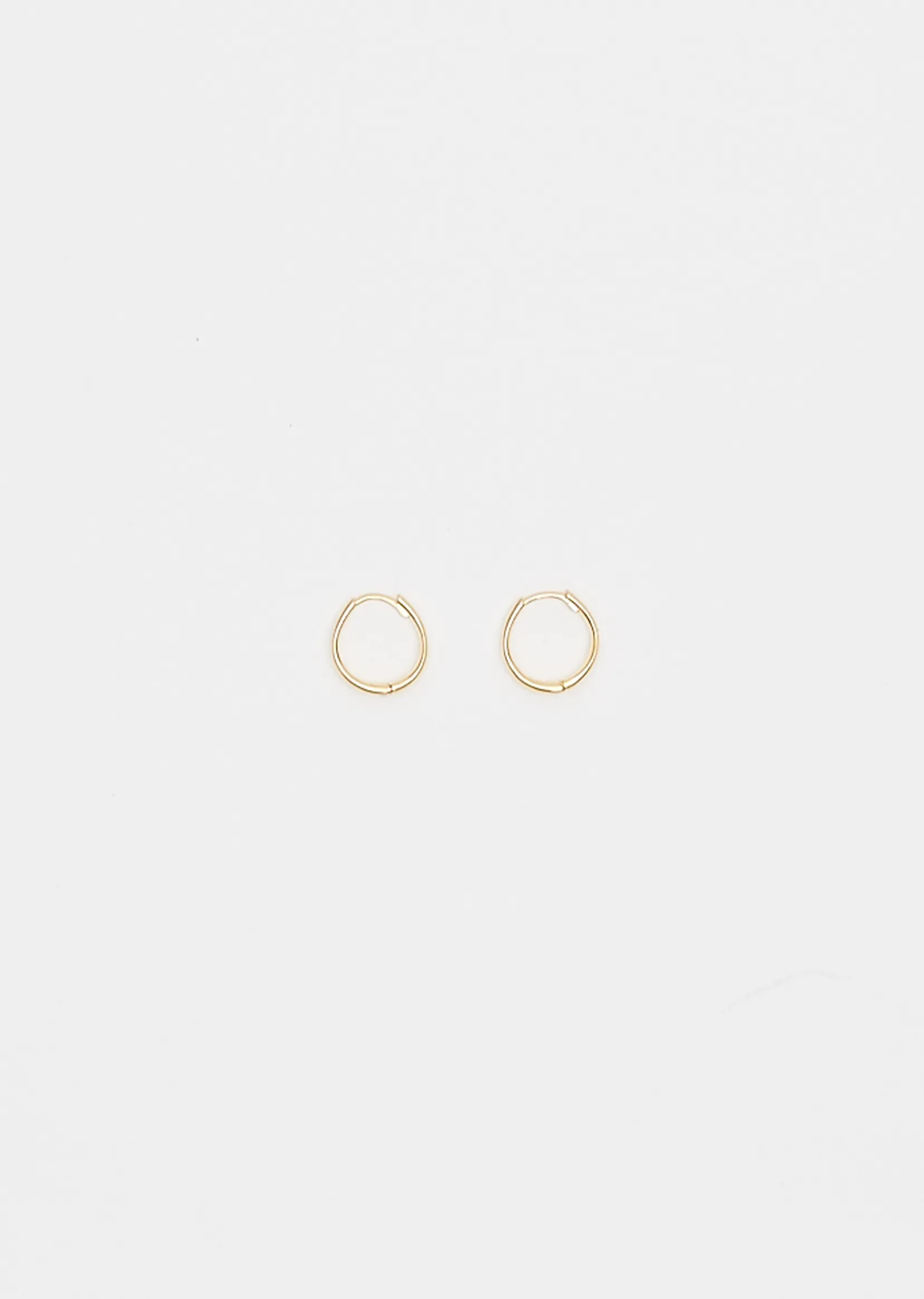 Gold Medium Intrinsic Hoops sold by La Garconne