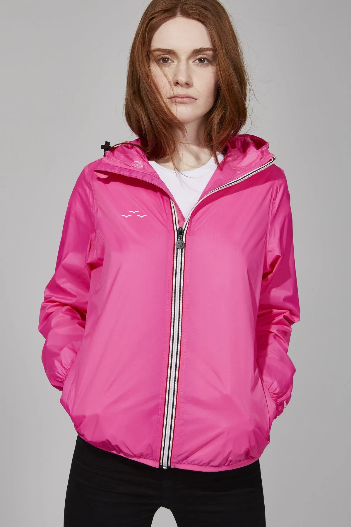 Women's pink fluo full zip packable rain jacket and windbreaker sold by Lazypants