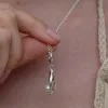 Silver Hand and Pearl Charm sold by Lily Charmed