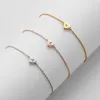 Dainty Heart Initial Station Bracelet sold by Limoges Jewelry