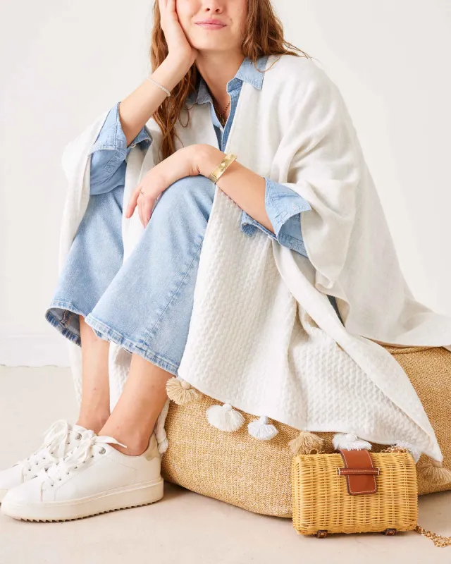 Classic Tassel Travel Wrap sold by Mersea