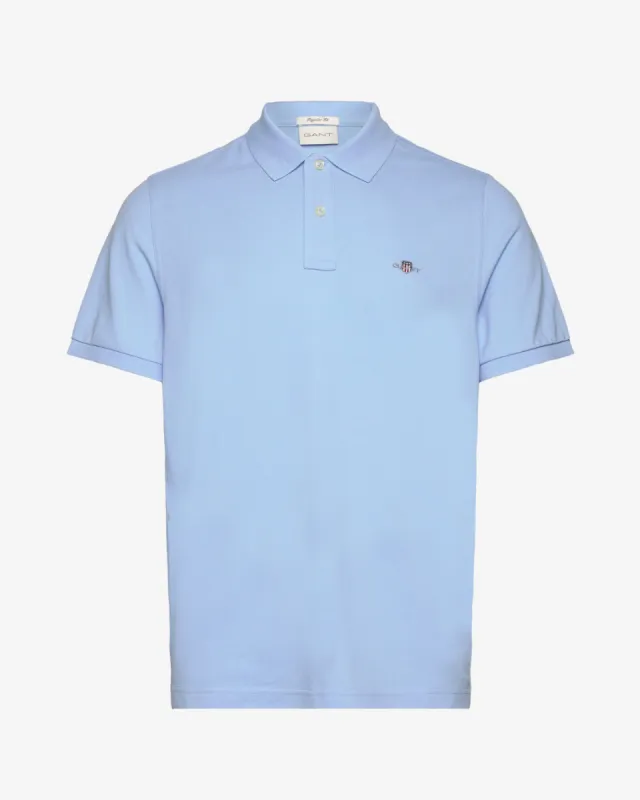 Reg shield pique polo - Lyseblå sold by Modish