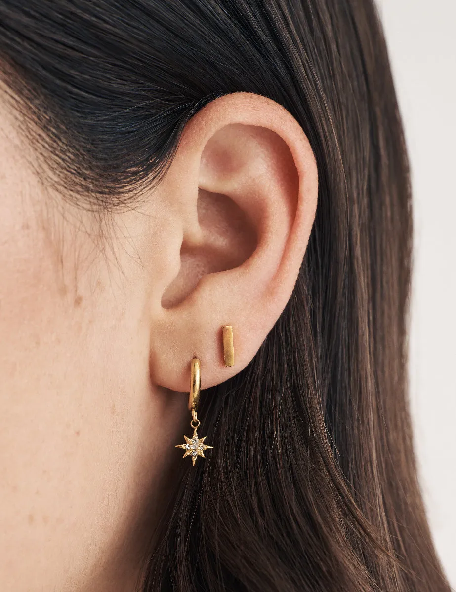 Gold Star Charm Huggie Hoop Earrings sold by Nobody's Child