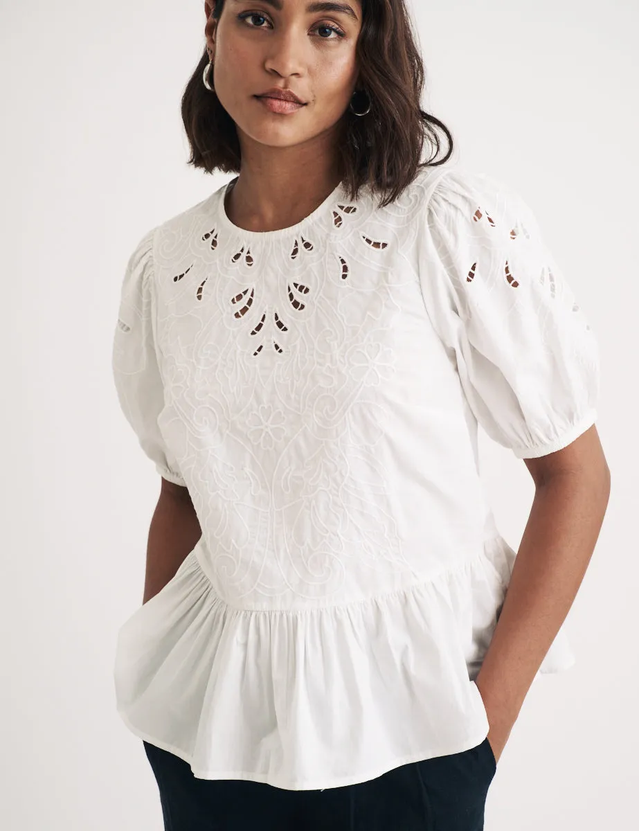 White Puff Sleeve Cutwork Detail Peplum Top sold by Nobody's Child