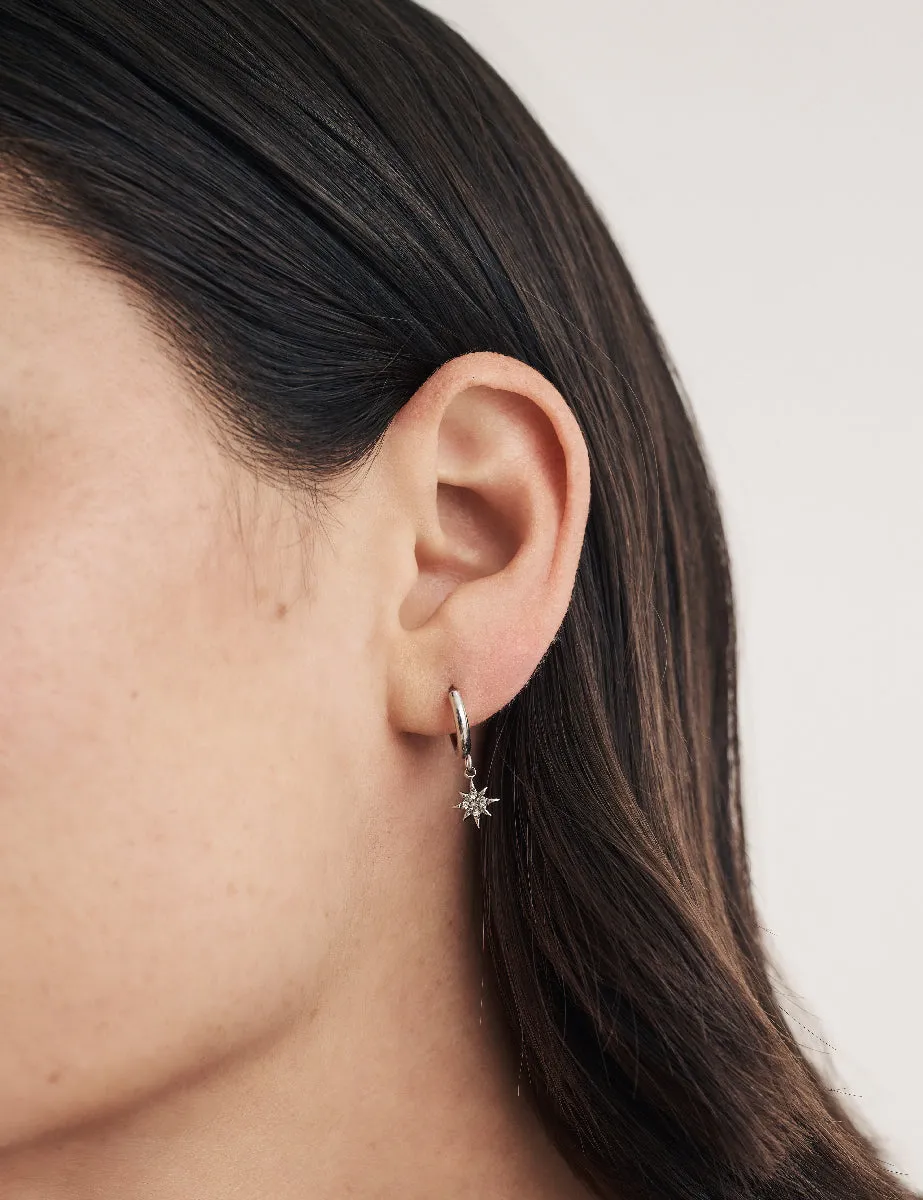 Silver Star Charm Huggie Hoop Earrings sold by Nobody's Child product image thumbnail 2