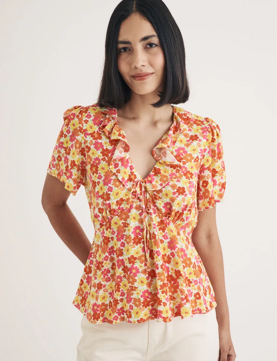 Orange Floral Ruffle Blouse sold by Nobody's Child