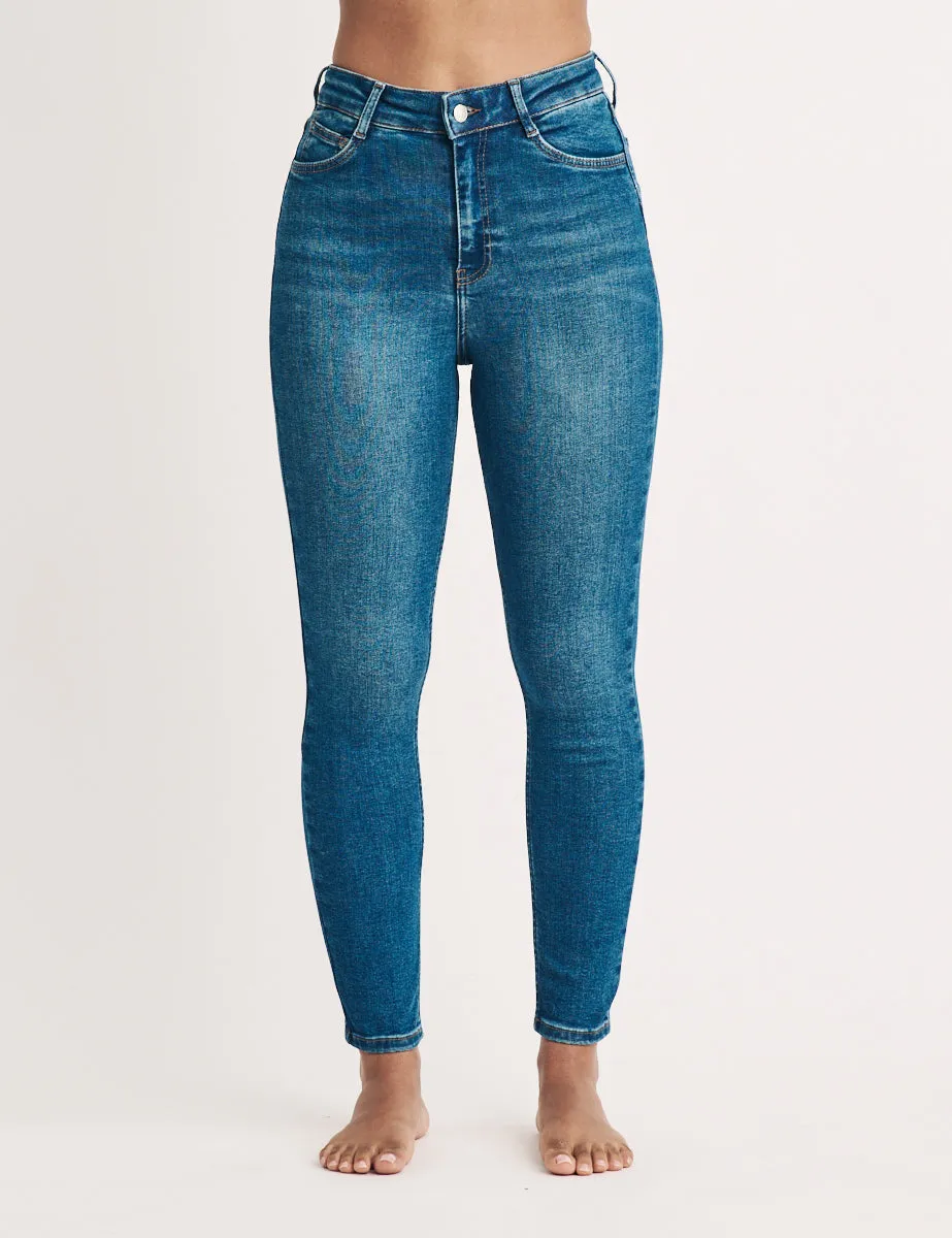 Mid Wash High Rise Skinny Jeans sold by Nobody's Child