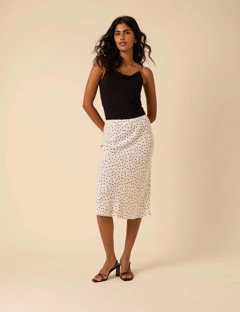 White Polka Dot Knee Length Slip Skirt sold by Nobody's Child