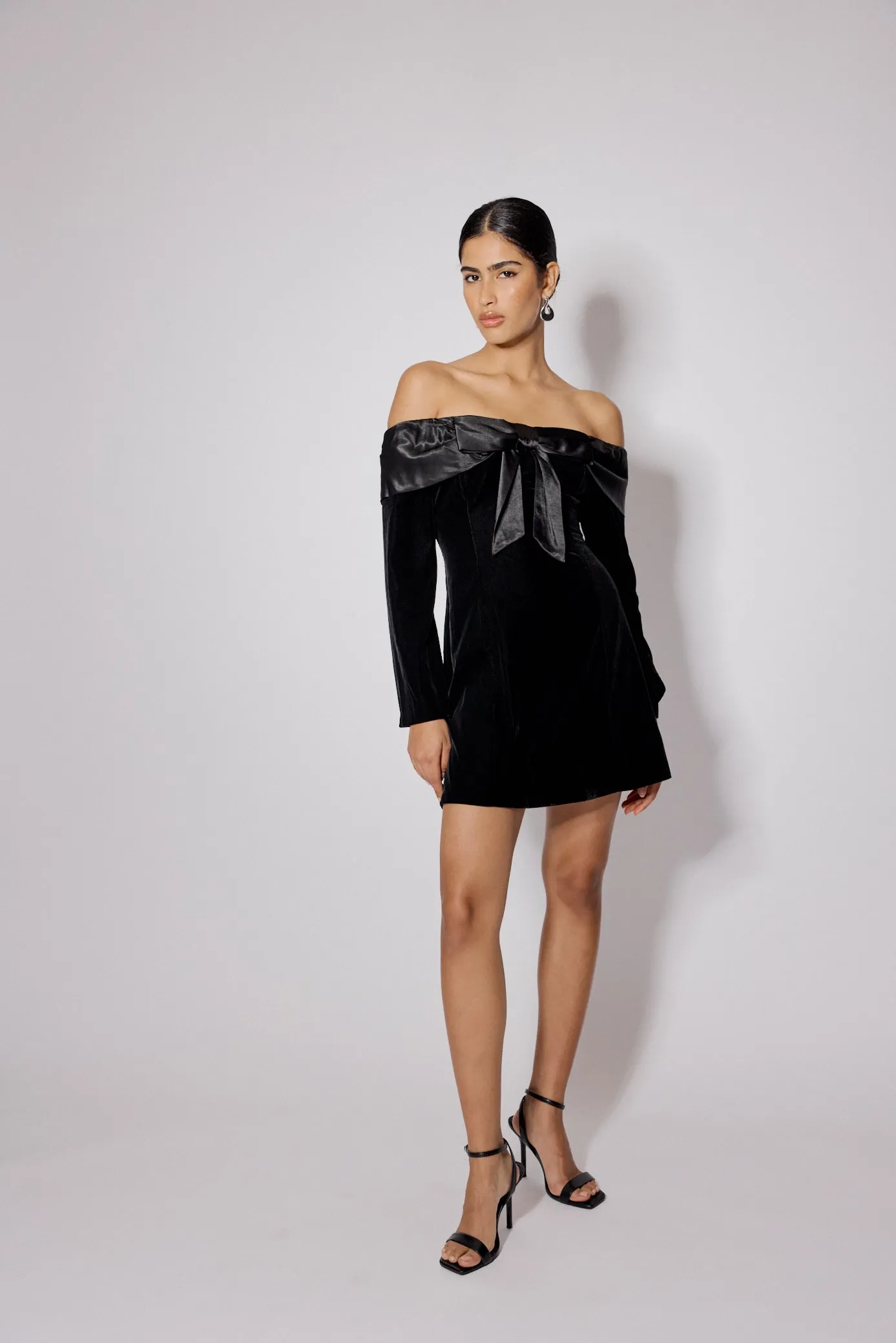 Black Velvet Off Shoulder Bow Capricorn Mini Dress sold by Nobody's Child