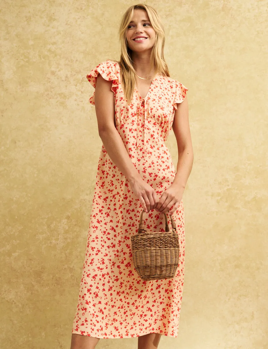Orange Ditsy Floral Lily Midi Dress sold by Nobody's Child