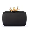 ADELE Orchid Lock Clutch sold by Olga Berg