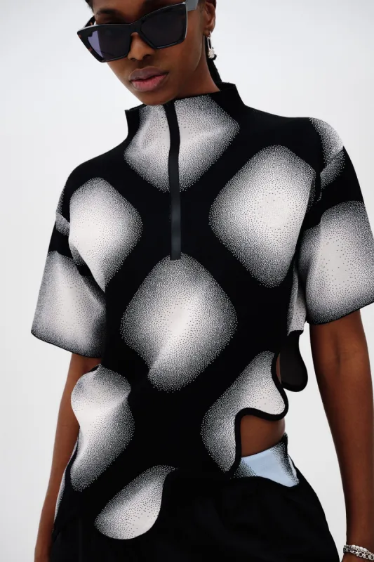 RINGO UV REACTIVE PLAID TOP WITH WAVY HEM sold by PH5