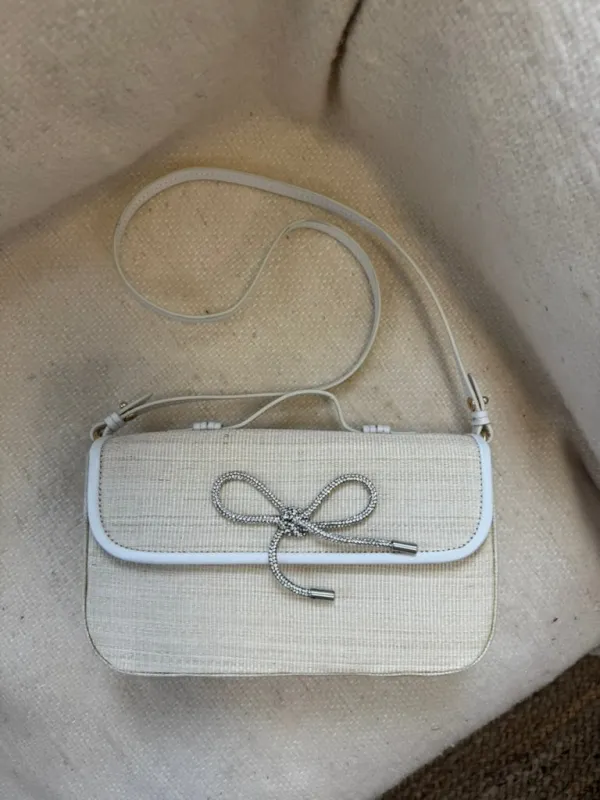 SALE - Bow Clutch With Strap sold by Poolside