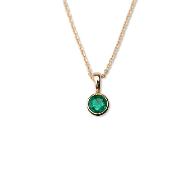 14k Circular Emerald Bezel Necklace sold by RG