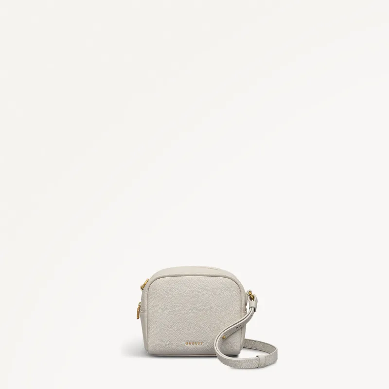 The Daily Mini Zip Around Cross Body Chalk - 110732 sold by Radley