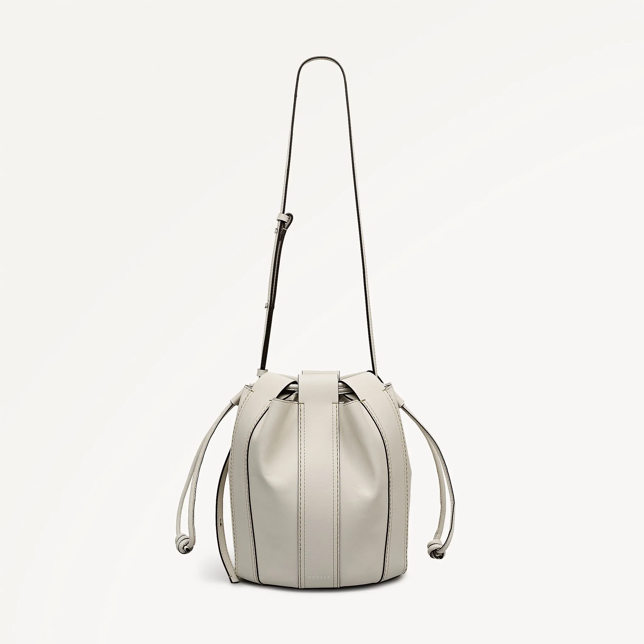 The Flora Medium Drawstring Cross Body Salt - 113831 sold by Radley