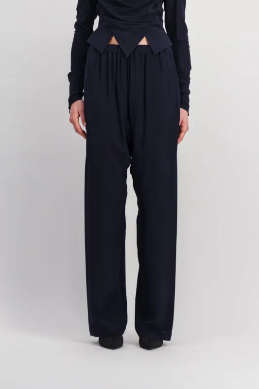 Loose pleated sarouel pants sold by Renaisa