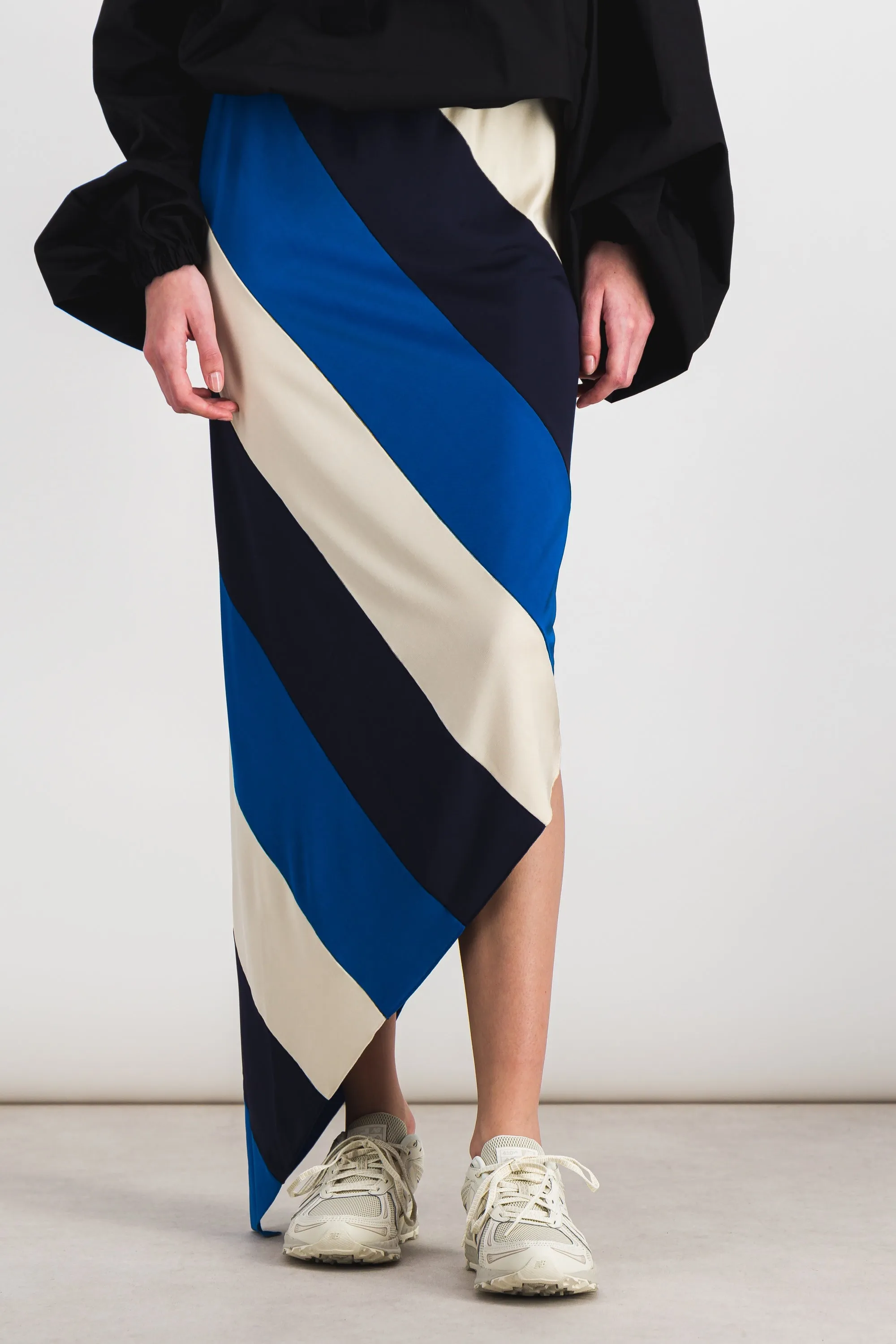 Spiral fluid jersey midi skirt sold by Renaisa