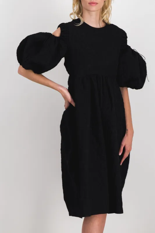 Matelassé puff sleeve dress with tulip skirt made by Cecilie Bahnsen