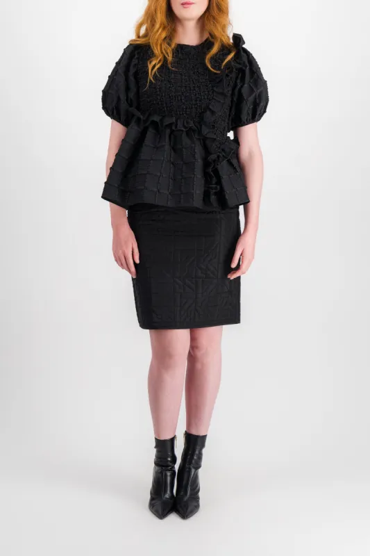 Blouse with smocked panels and ruffles sold by Renaisa
