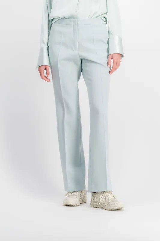 Slim leg compact wool grain de poudre pants sold by Renaisa
