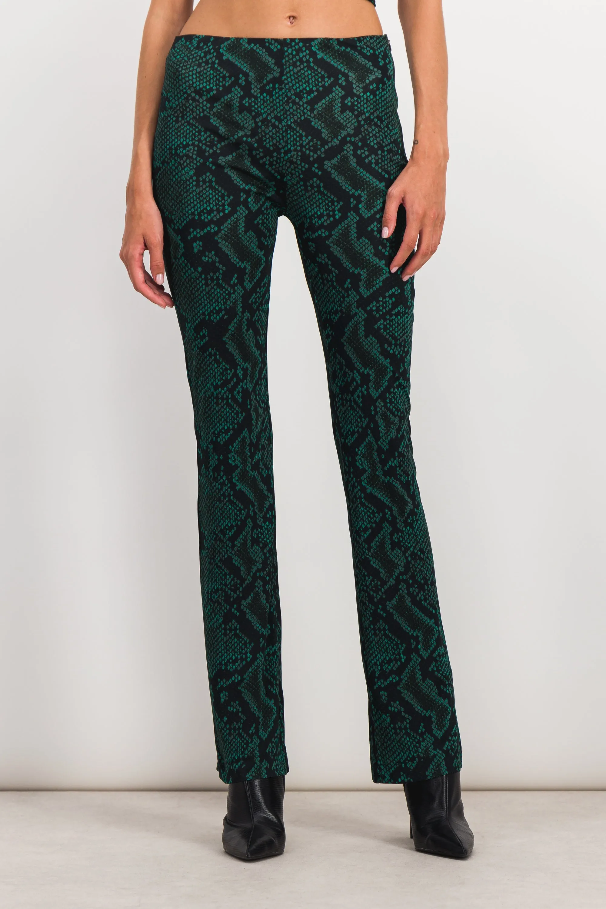 Green snake print slim straight leg pants sold by Renaisa