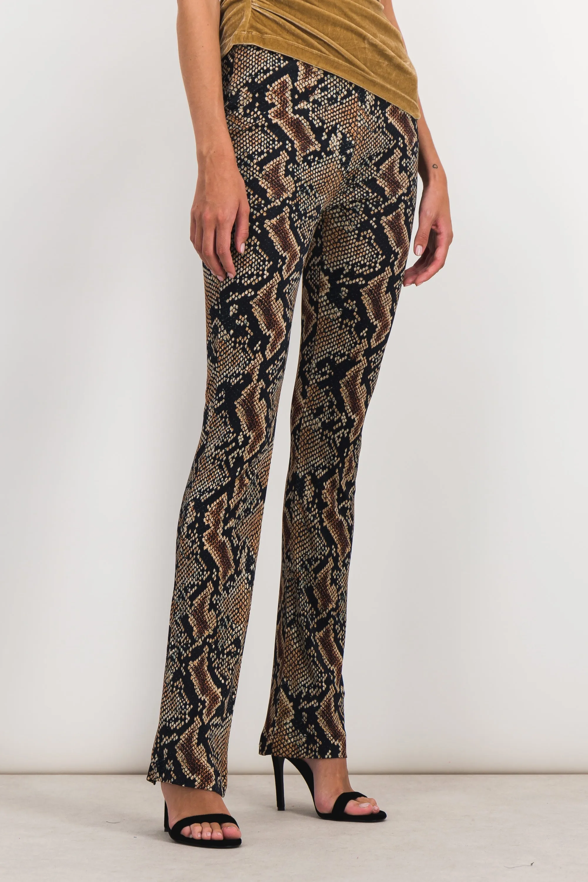 Snake print slim straight leg pants sold by Renaisa