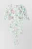 Printed light satin fluid top sold by Renaisa