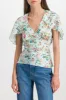 Printed light satin fluid top sold by Renaisa