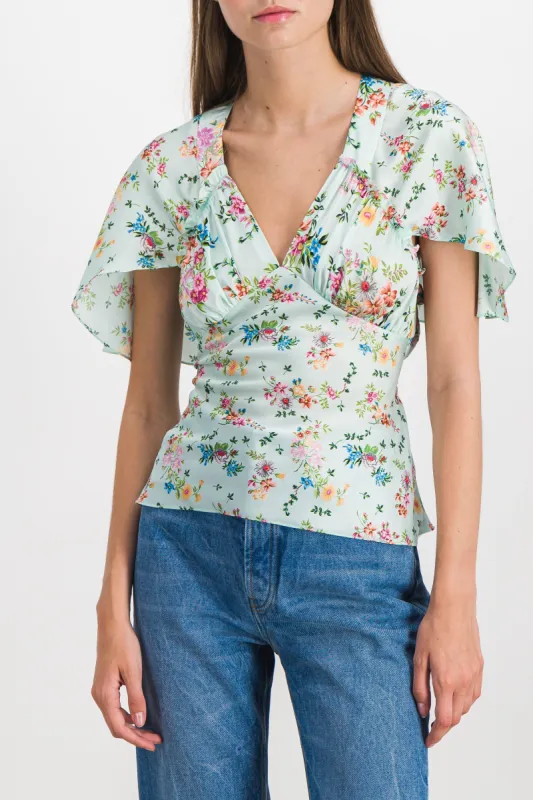 Printed light satin fluid top sold by Renaisa