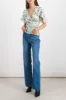 Printed light satin fluid top sold by Renaisa