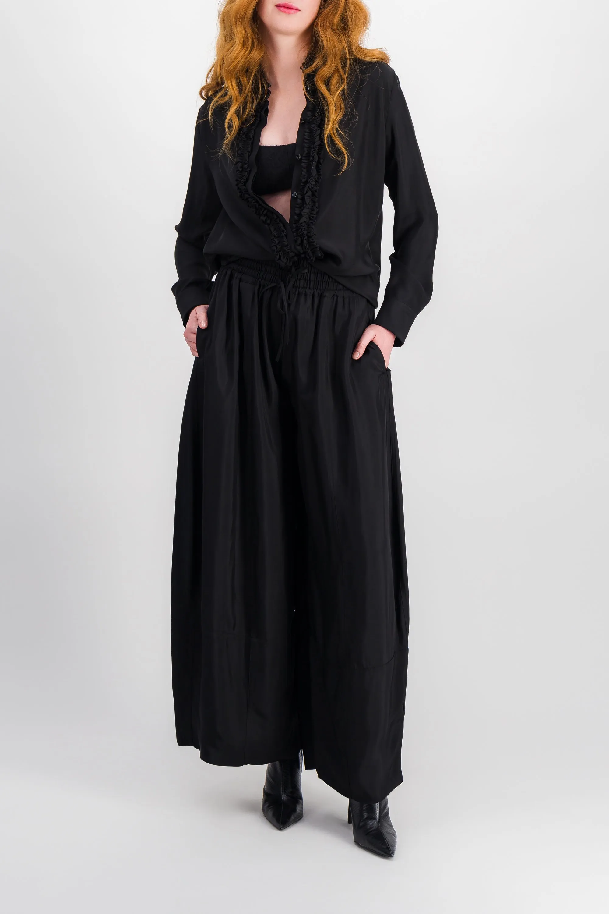 Washed fluid viscose shirt with ruffled colllar and buttonlining sold by Renaisa