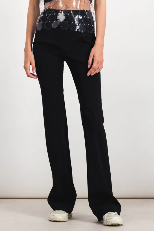 Black slide flared pants sold by Renaisa