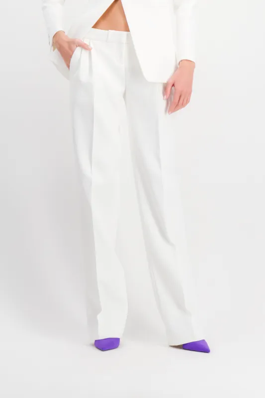 White low rise loose tailored pants sold by Renaisa