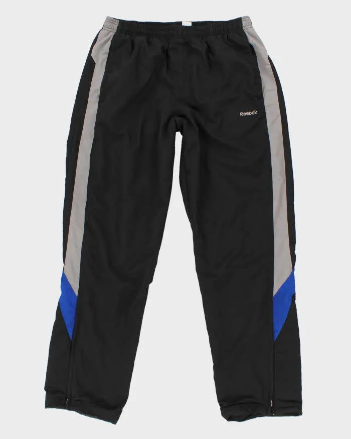 00s Reebok Track Bottoms - M sold by Rokit