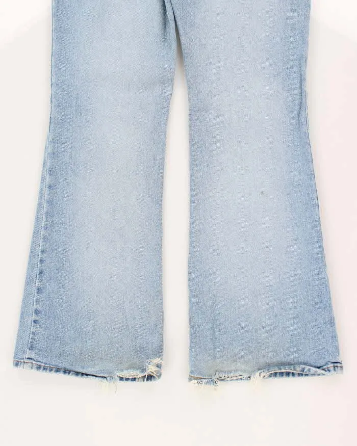 Vintage Y2K Women's Light Wash Flare Jeans - W30 L30 sold by Rokit product image thumbnail 4