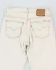 Vintage Levi's 501 Cream Jeans - W30 L32 sold by Rokit
