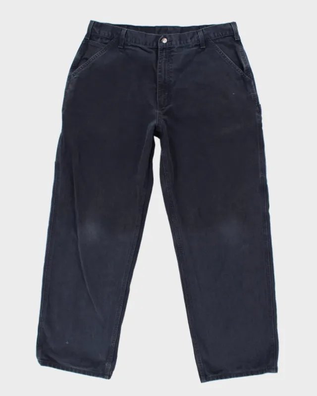 Vintage Carhartt Navy Workwear Trousers - W34 L29 sold by Rokit