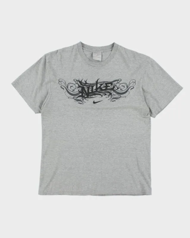 Vintage Y2K Nike Tribal Logo T-Shirt - L sold by Rokit