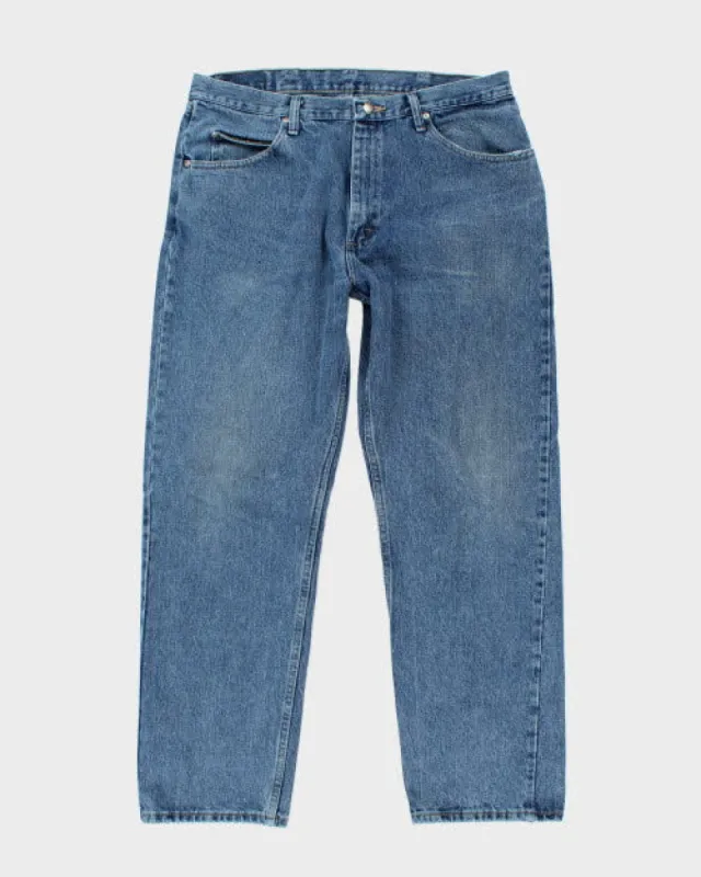 Vintage Wrangler Relaxed Fit Medium Wash Jeans - W34 L29 sold by Rokit
