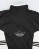 Vintage 90's Adidas Synched Waist Lightweight Jacket - L sold by Rokit