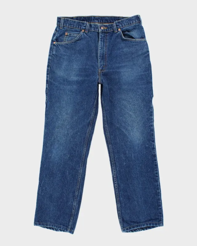 Vintage 90s Levi's 619 Orange Tab Dark Wash Jeans - W34 L30 made by Levi's