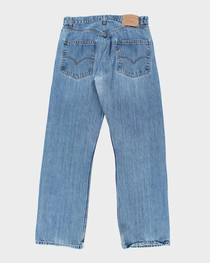 Vintage Levi's Regular Fit Medium Wash Jeans - W34 L32 sold by Rokit product image thumbnail 2