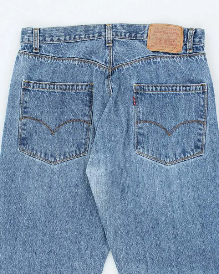 Vintage Levi's Regular Fit Medium Wash Jeans - W34 L32 sold by Rokit product image thumbnail 4