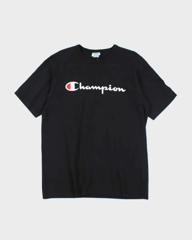 Vintage 2000's Champion Spell Out Graphic T-Shirt - XL sold by Rokit