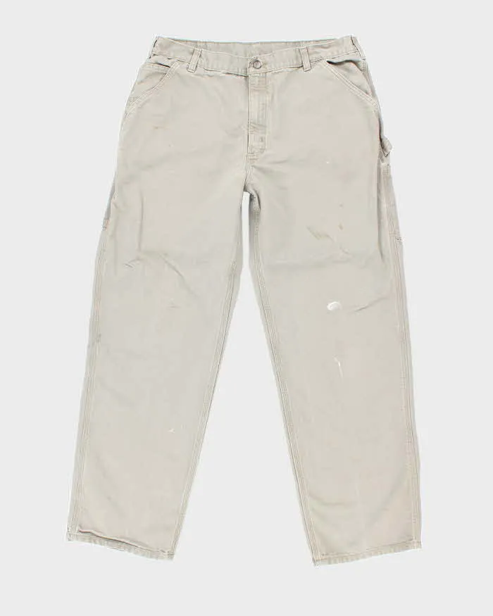 Vintage Carhartt Green Faded Single Knee Carpenter Trousers - W34 L31 sold by Rokit
