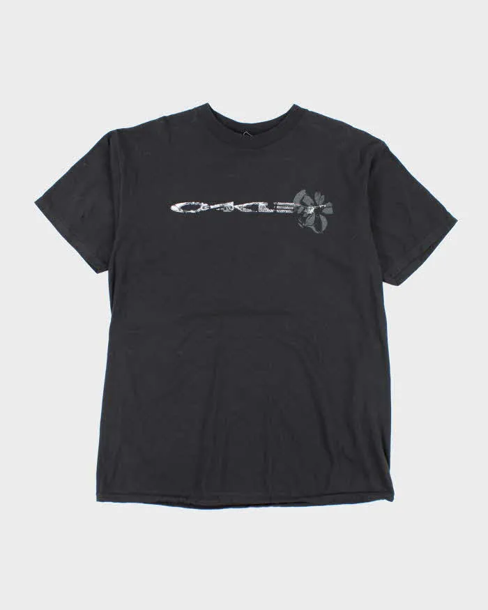 Vintage Y2K Oakley Spell Logo Graphic T-Shirt - L sold by Rokit